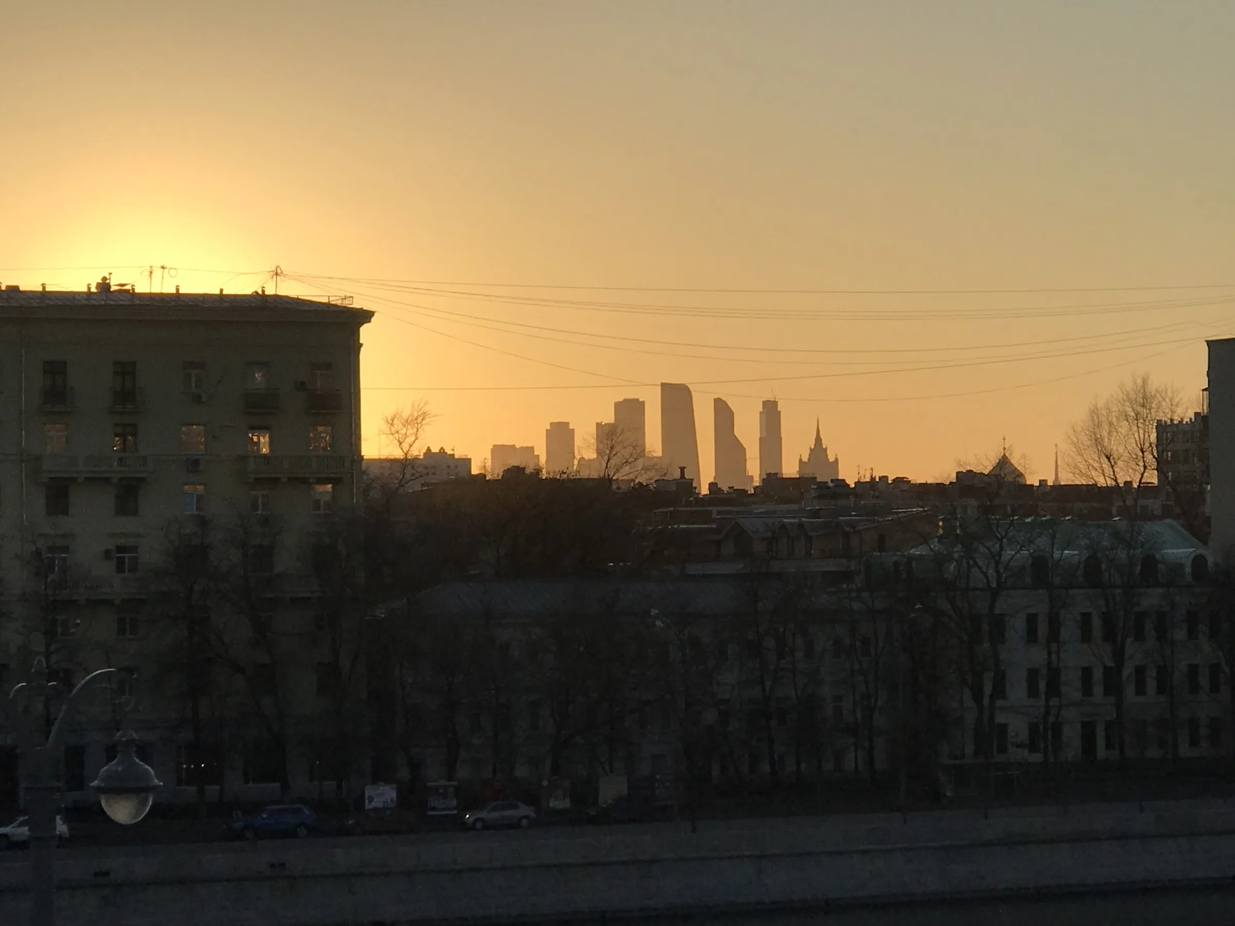 Moscow skyline along the river at golden hour. Photo: Vlad Lario.